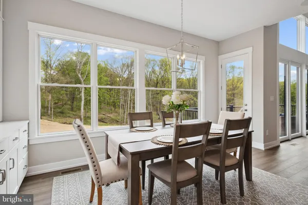 a view of a dining room with furniture window and outside view