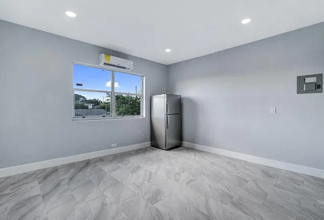 a view of an empty room with a window