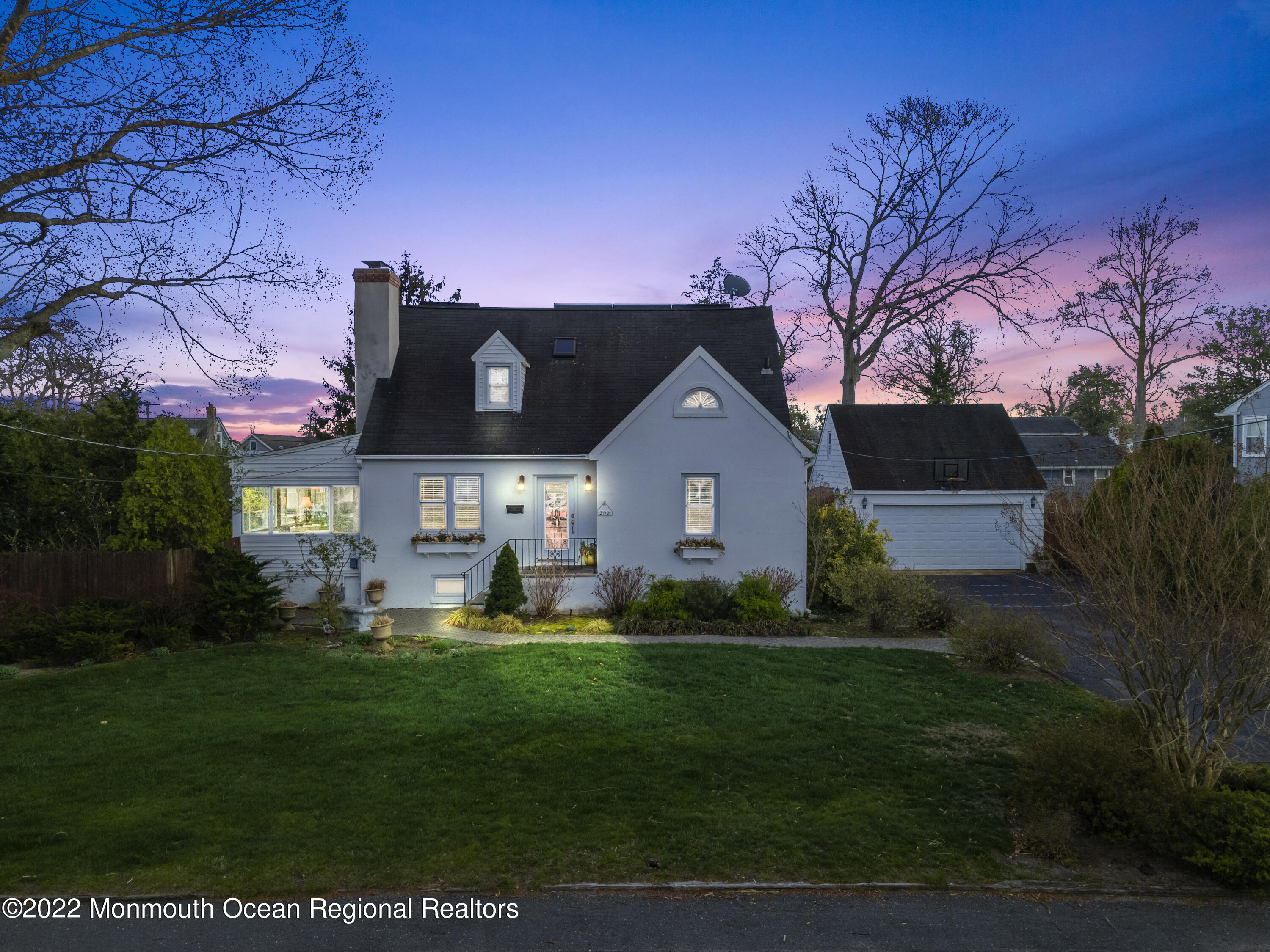 2112 Foster Road Point Pleasant, NJ 08742 - Photo 1 of 57 a front view of a house with a garden and trees