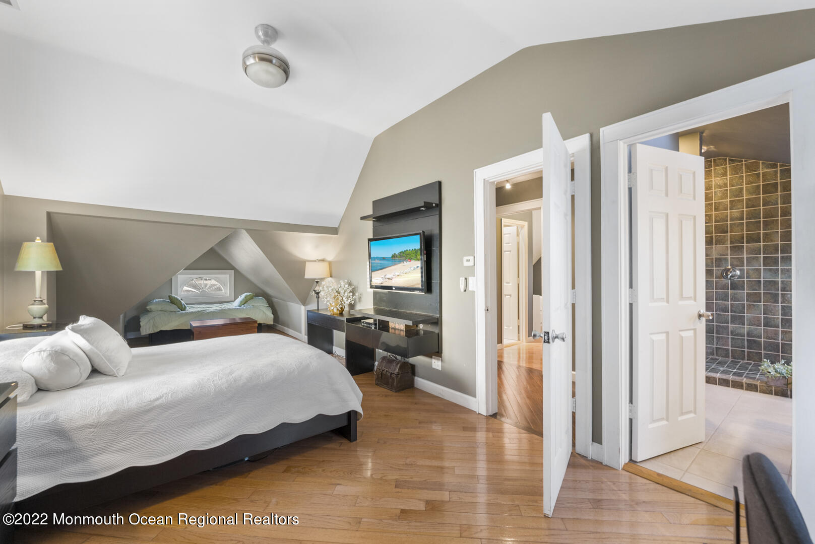 2112 Foster Road Point Pleasant, NJ 08742 - Photo 32 of 57 a bedroom with a bed and a large mirror