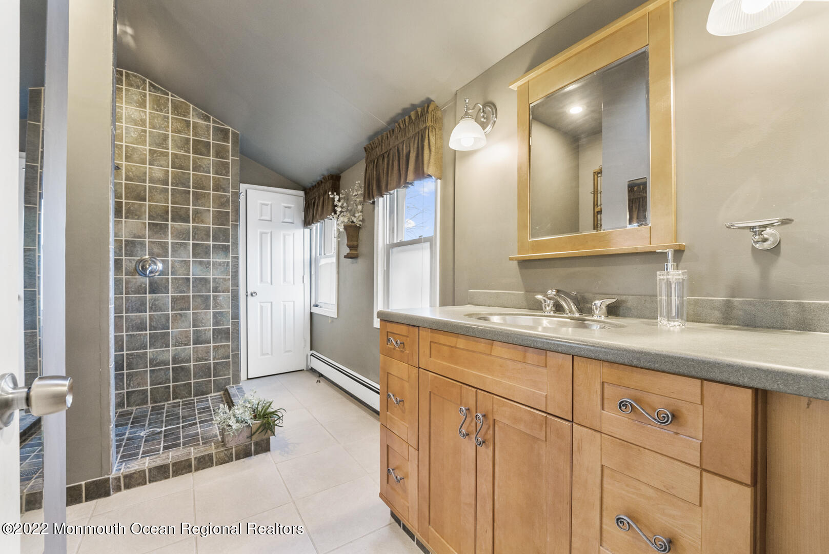 2112 Foster Road Point Pleasant, NJ 08742 - Photo 35 of 57 a bathroom with a granite countertop sink a mirror and shower