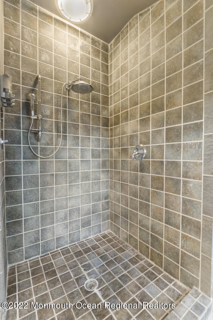 2112 Foster Road Point Pleasant, NJ 08742 - Photo 37 of 57 a bathroom with a blue shower