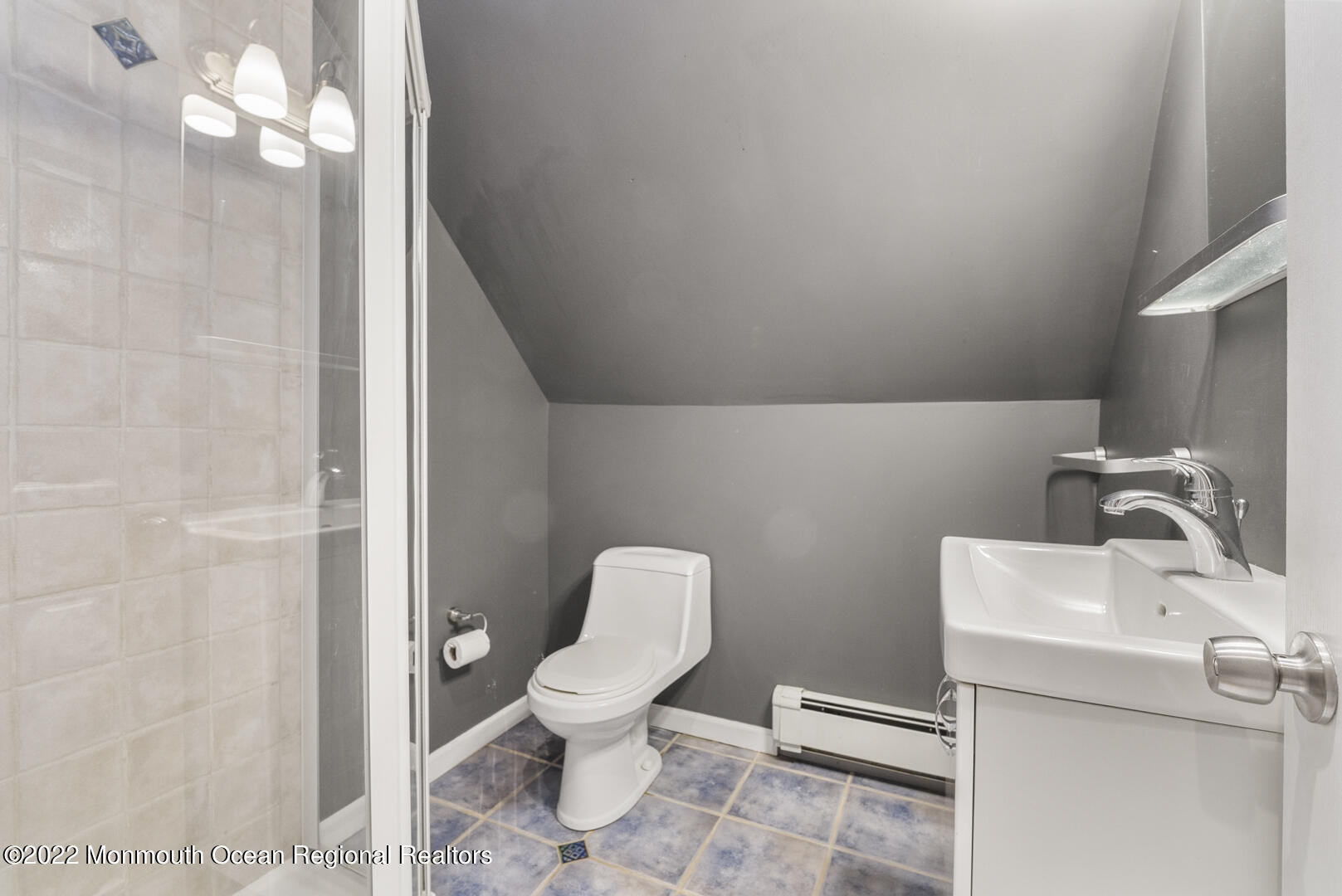 2112 Foster Road Point Pleasant, NJ 08742 - Photo 40 of 57 a white toilet sitting next to a bathroom sink