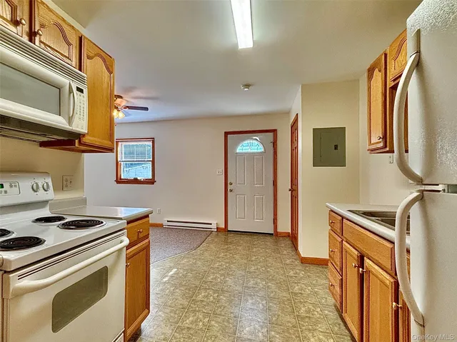 a kitchen with stainless steel appliances granite countertop a stove and a refrigerator