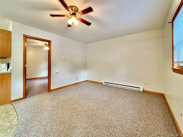 a view of an empty room and window