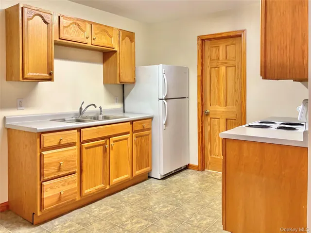 a view of a kitchen with a sink