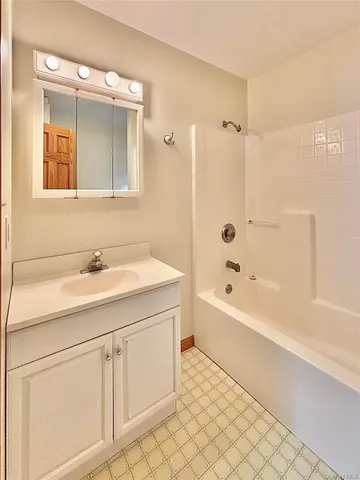 a kitchen with sink refrigerator and cabinets