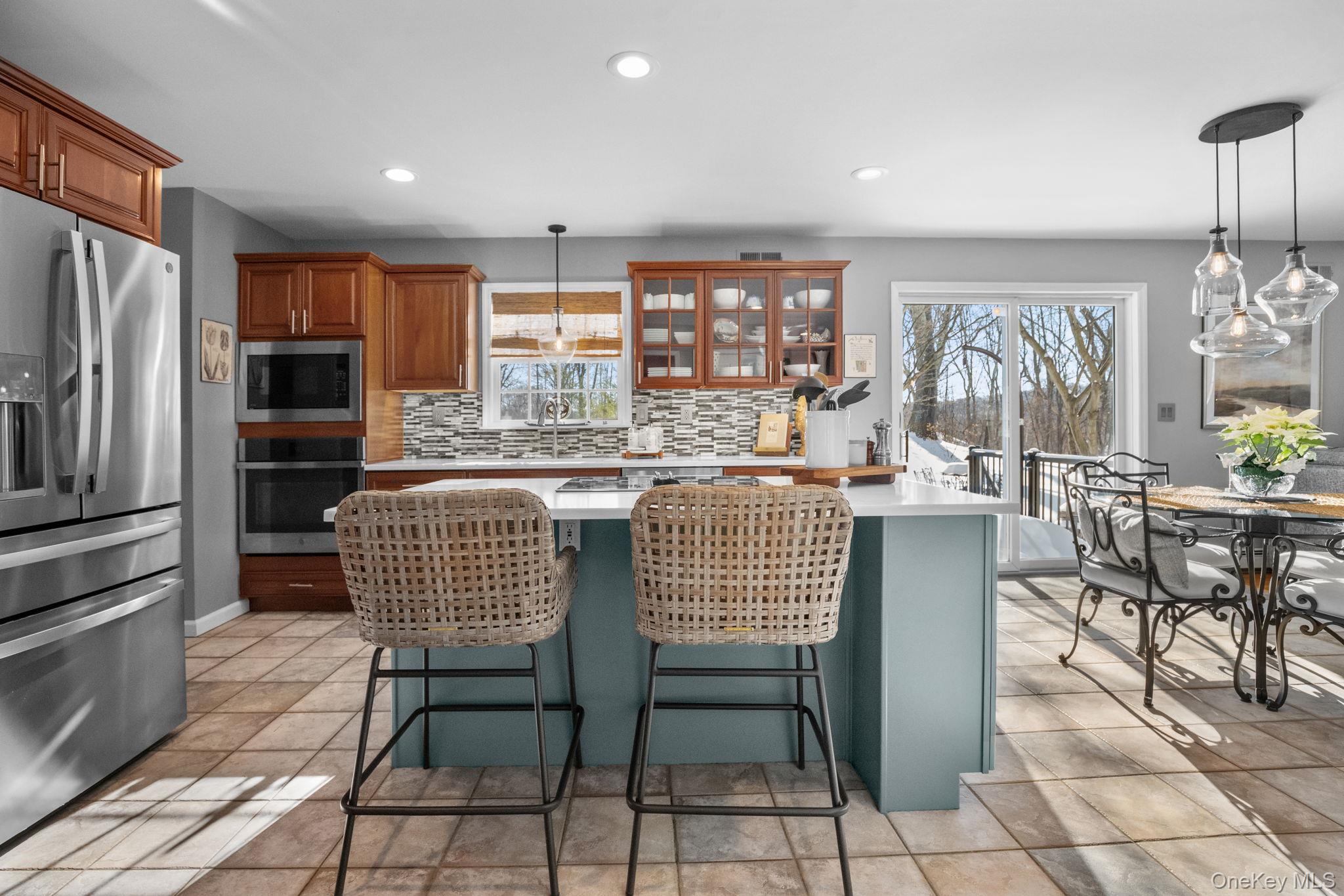 6 Ridge Circle Mahopac, NY 10541 - Photo 13 of 49 a dining room with furniture a chandelier and kitchen view