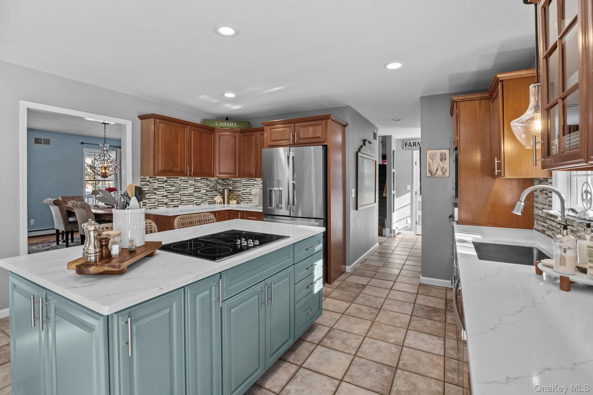 6 Ridge Circle Mahopac, NY 10541 - Photo 15 of 49 a kitchen with stainless steel appliances granite countertop a sink and a refrigerator