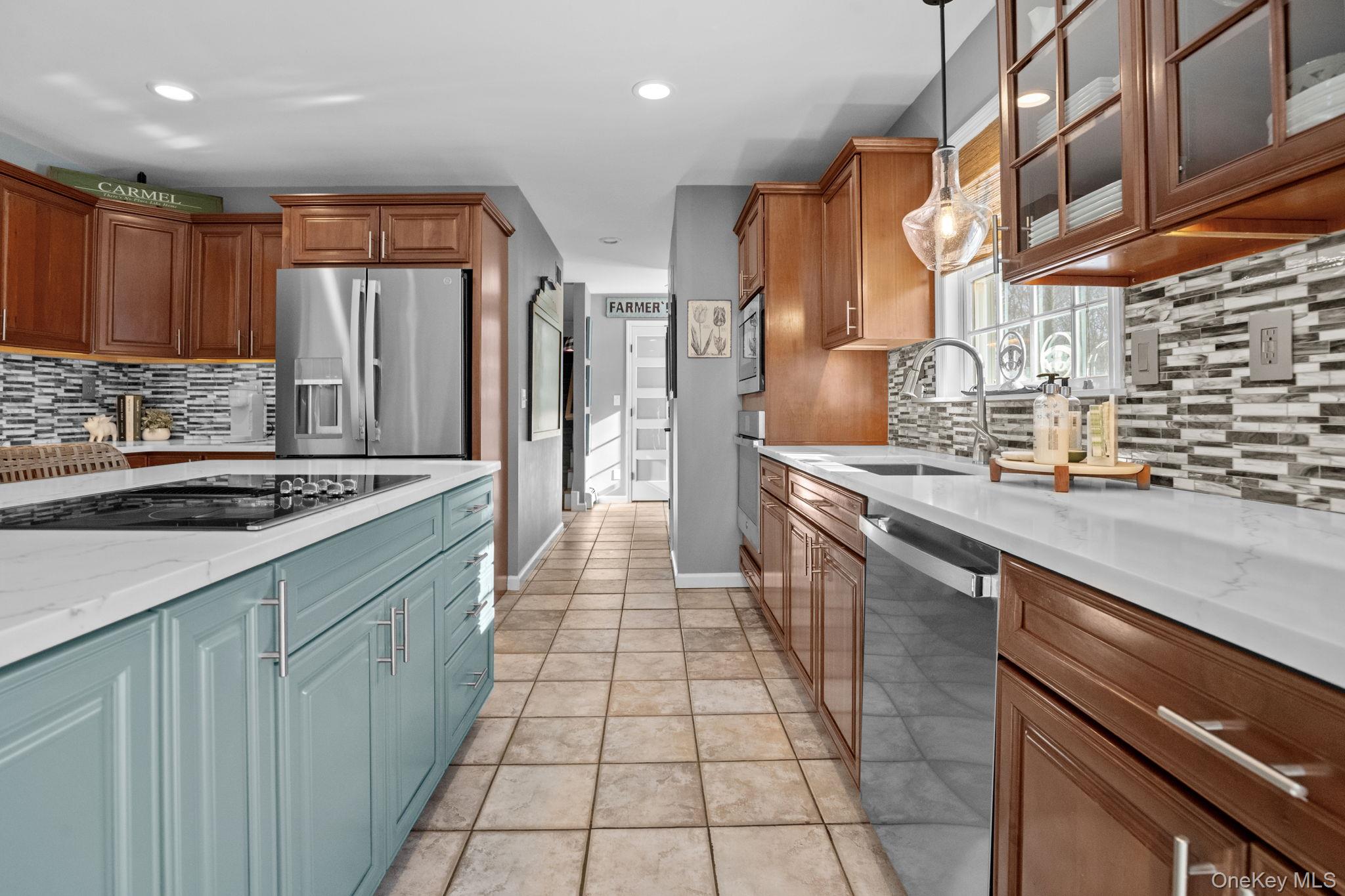 6 Ridge Circle Mahopac, NY 10541 - Photo 16 of 49 a kitchen with stainless steel appliances granite countertop a sink and cabinets