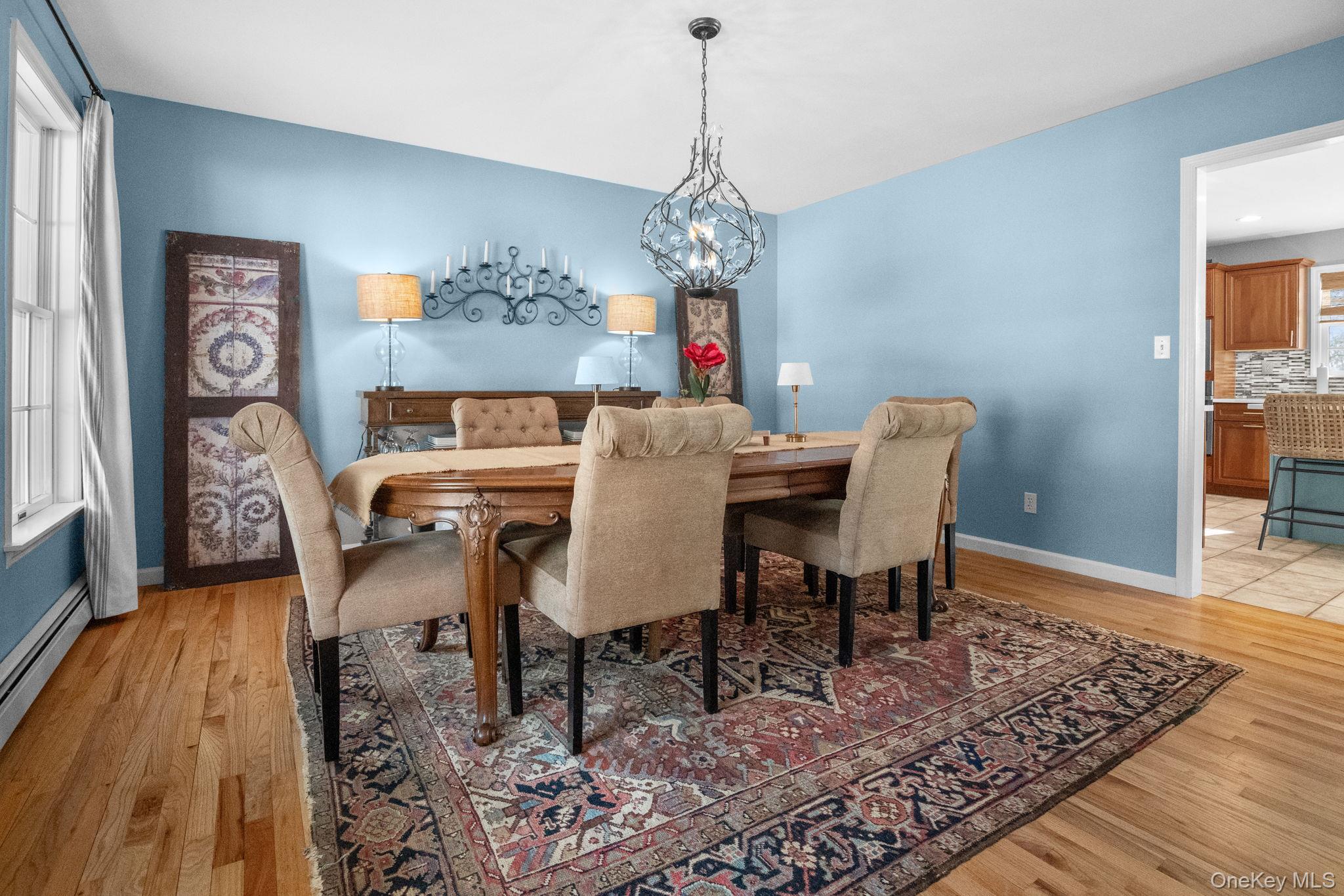 6 Ridge Circle Mahopac, NY 10541 - Photo 17 of 49 a view of a dining room with furniture wooden floor and a chandelier