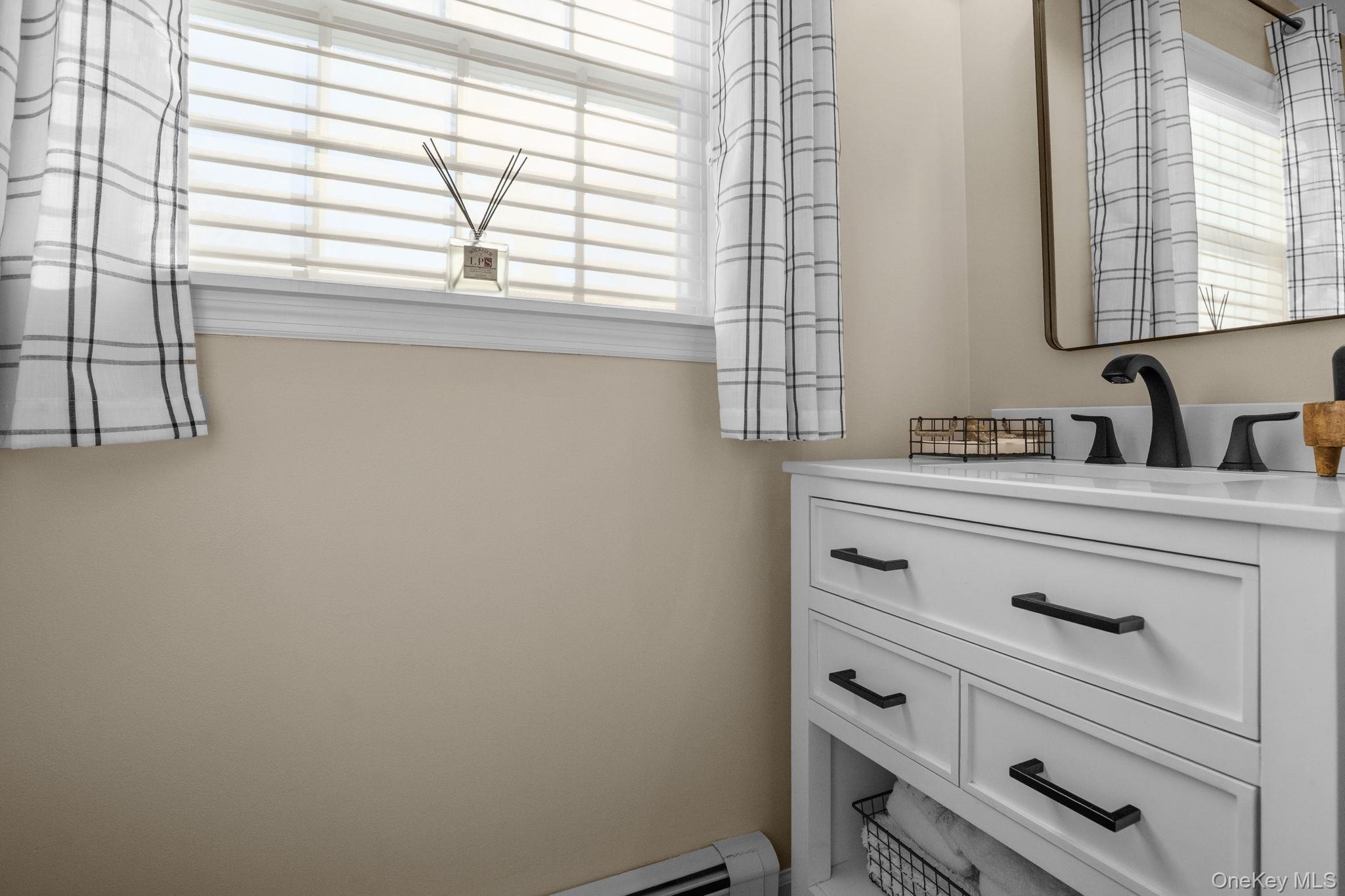 6 Ridge Circle Mahopac, NY 10541 - Photo 19 of 49 a bathroom with a sink and a window