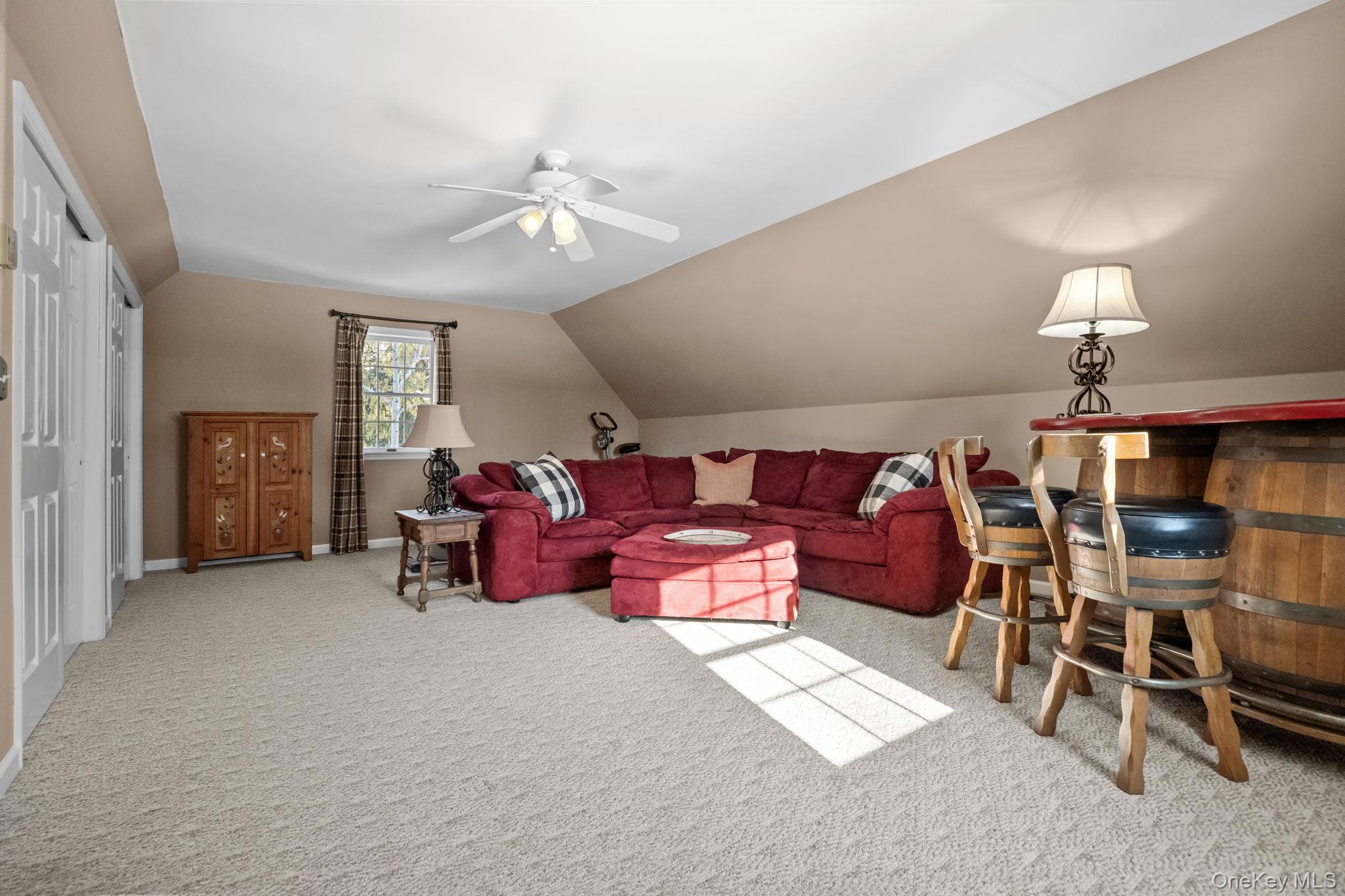 6 Ridge Circle Mahopac, NY 10541 - Photo 20 of 49 a living room with furniture and a chandelier