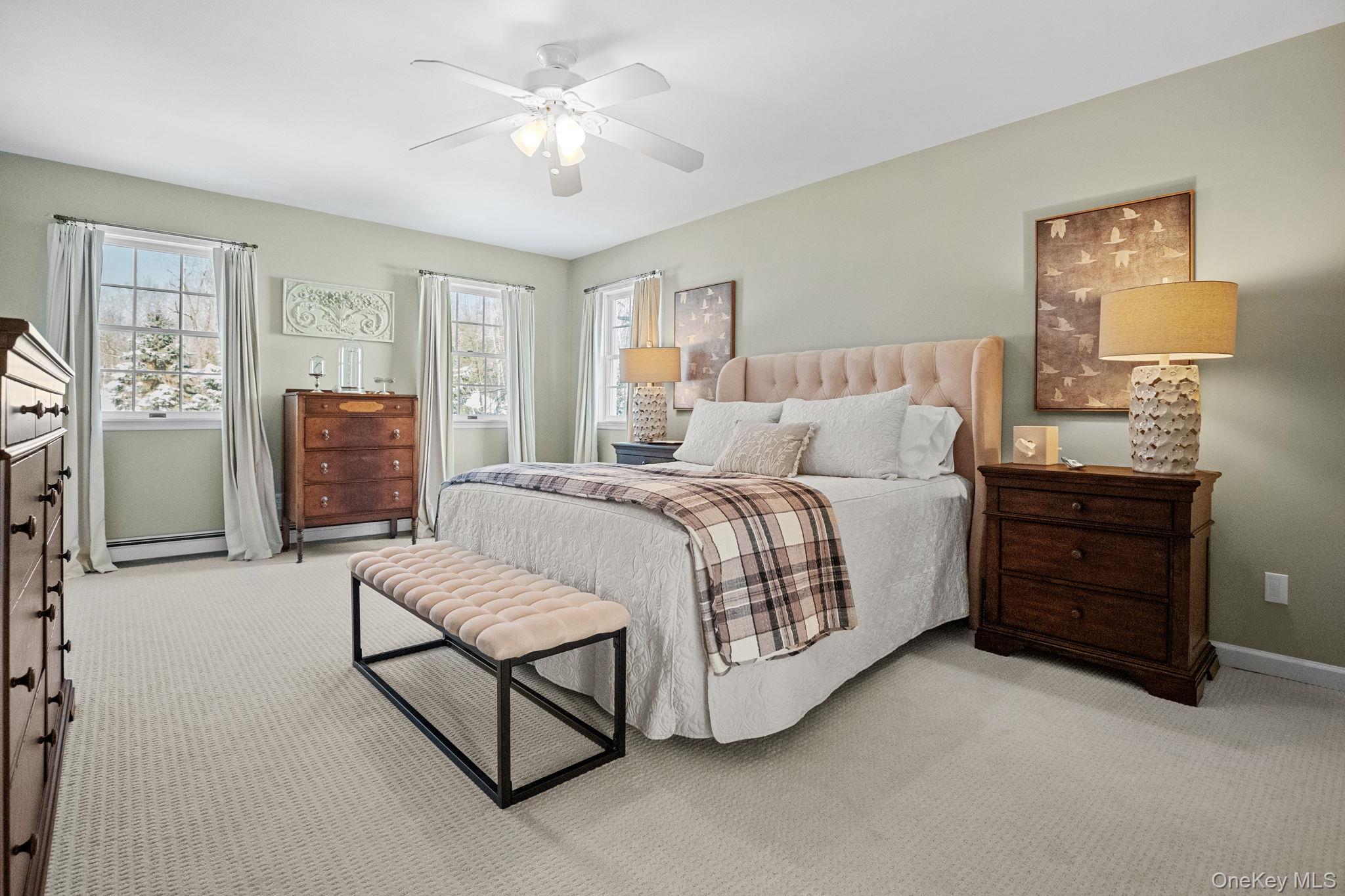 6 Ridge Circle Mahopac, NY 10541 - Photo 24 of 49 a spacious bedroom with a bed and dresser