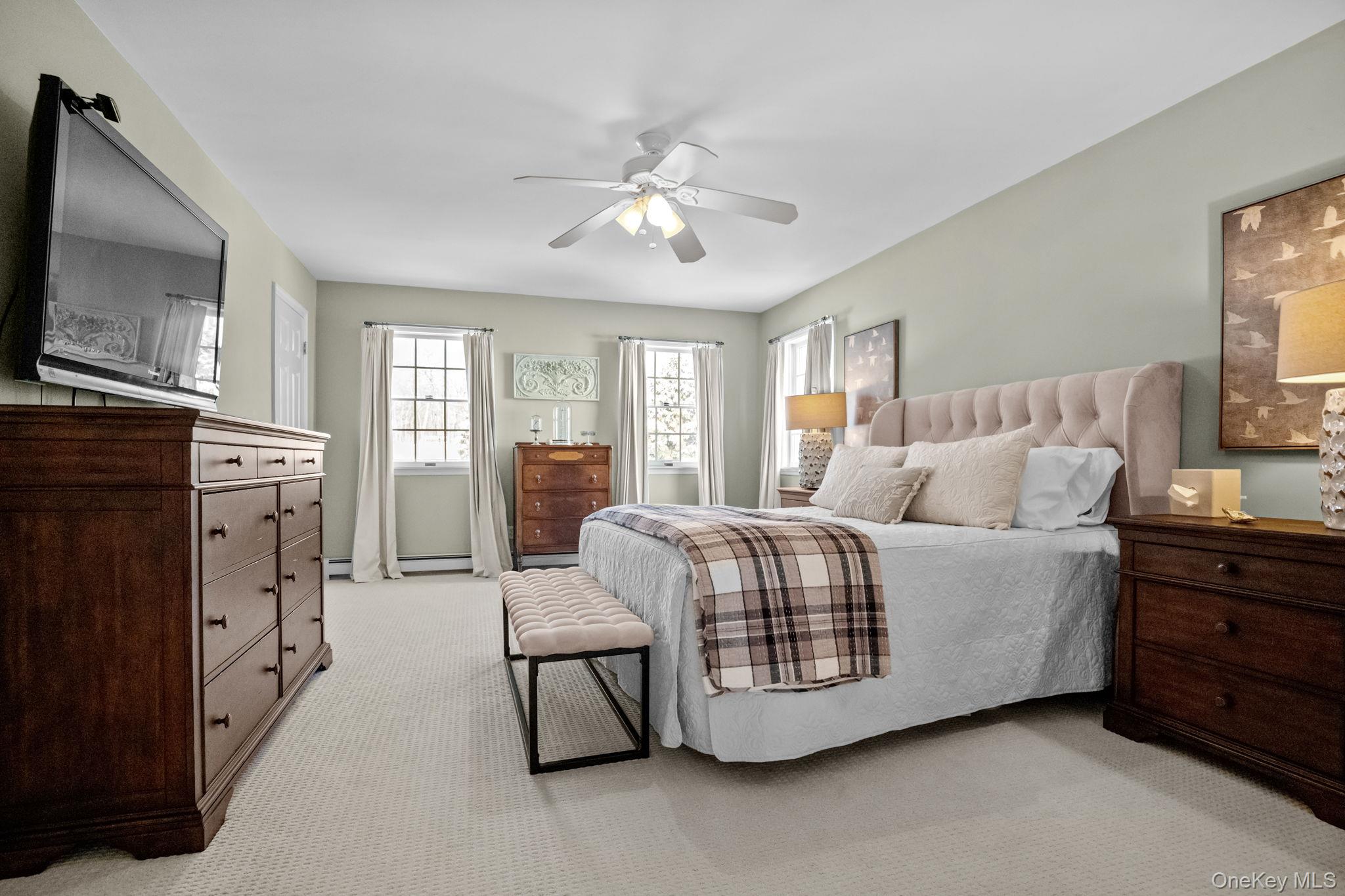 6 Ridge Circle Mahopac, NY 10541 - Photo 25 of 49 a living room with furniture and a flat screen tv