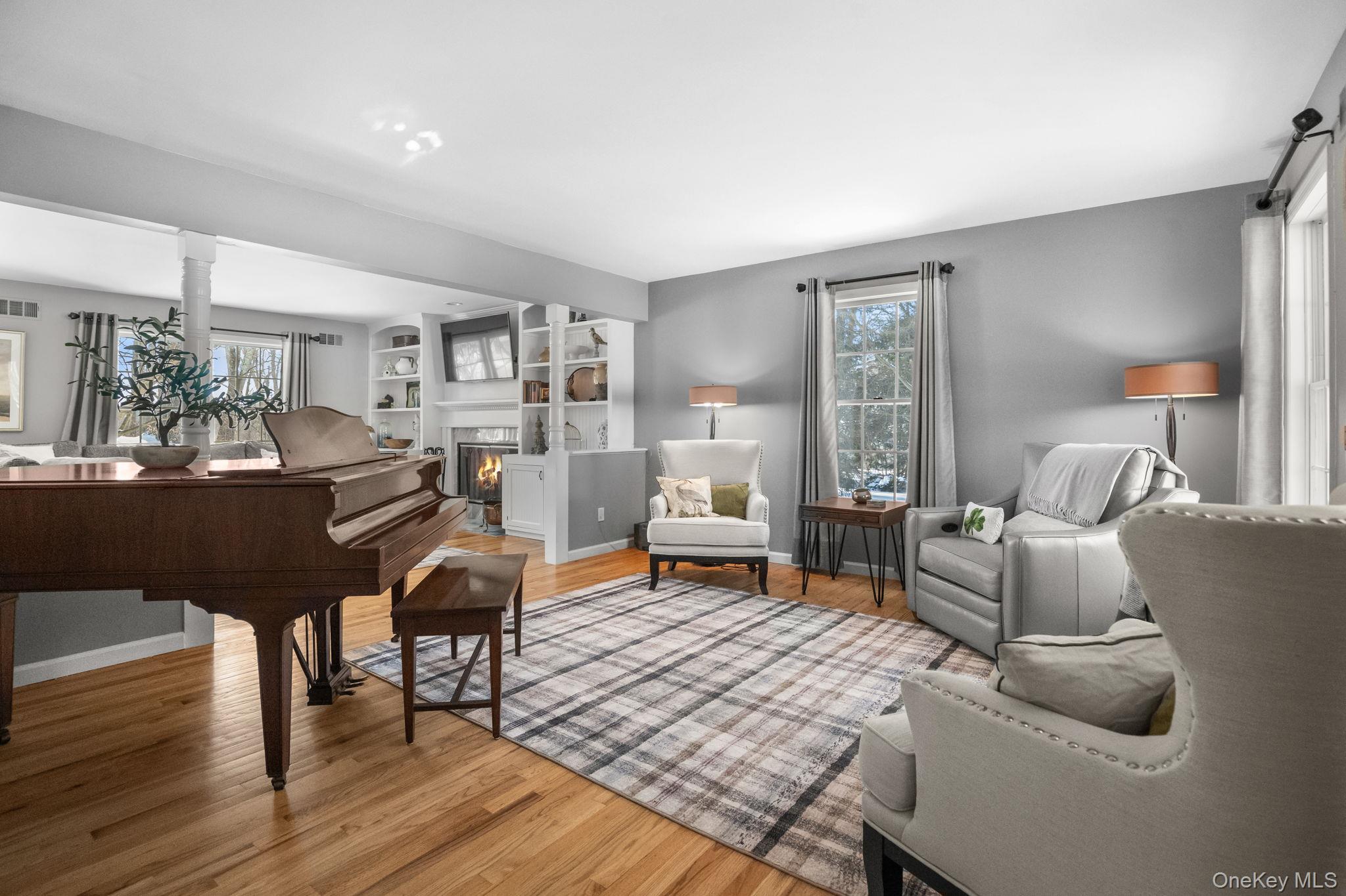 6 Ridge Circle Mahopac, NY 10541 - Photo 3 of 49 a living room with furniture and a dining table with wooden floor