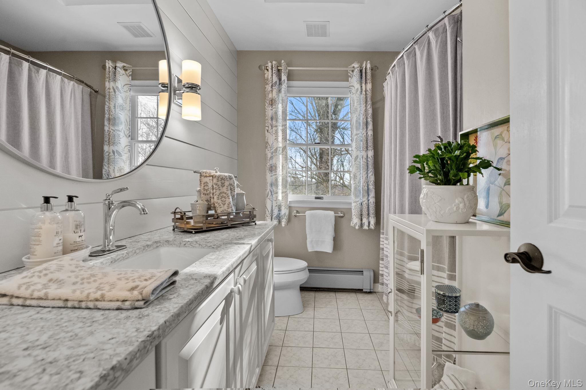 6 Ridge Circle Mahopac, NY 10541 - Photo 31 of 49 a bathroom with a granite countertop sink a mirror and shower