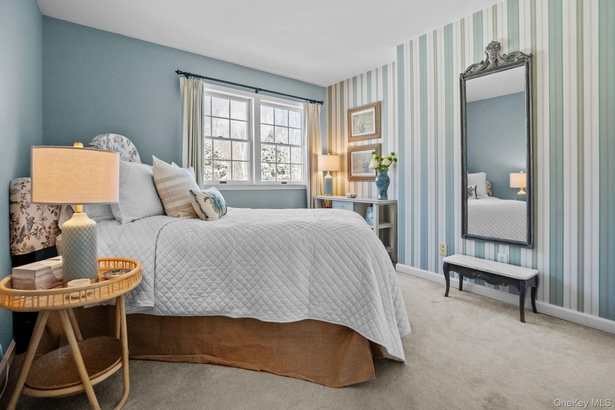 6 Ridge Circle Mahopac, NY 10541 - Photo 35 of 49 a bedroom with a bed and a table in it