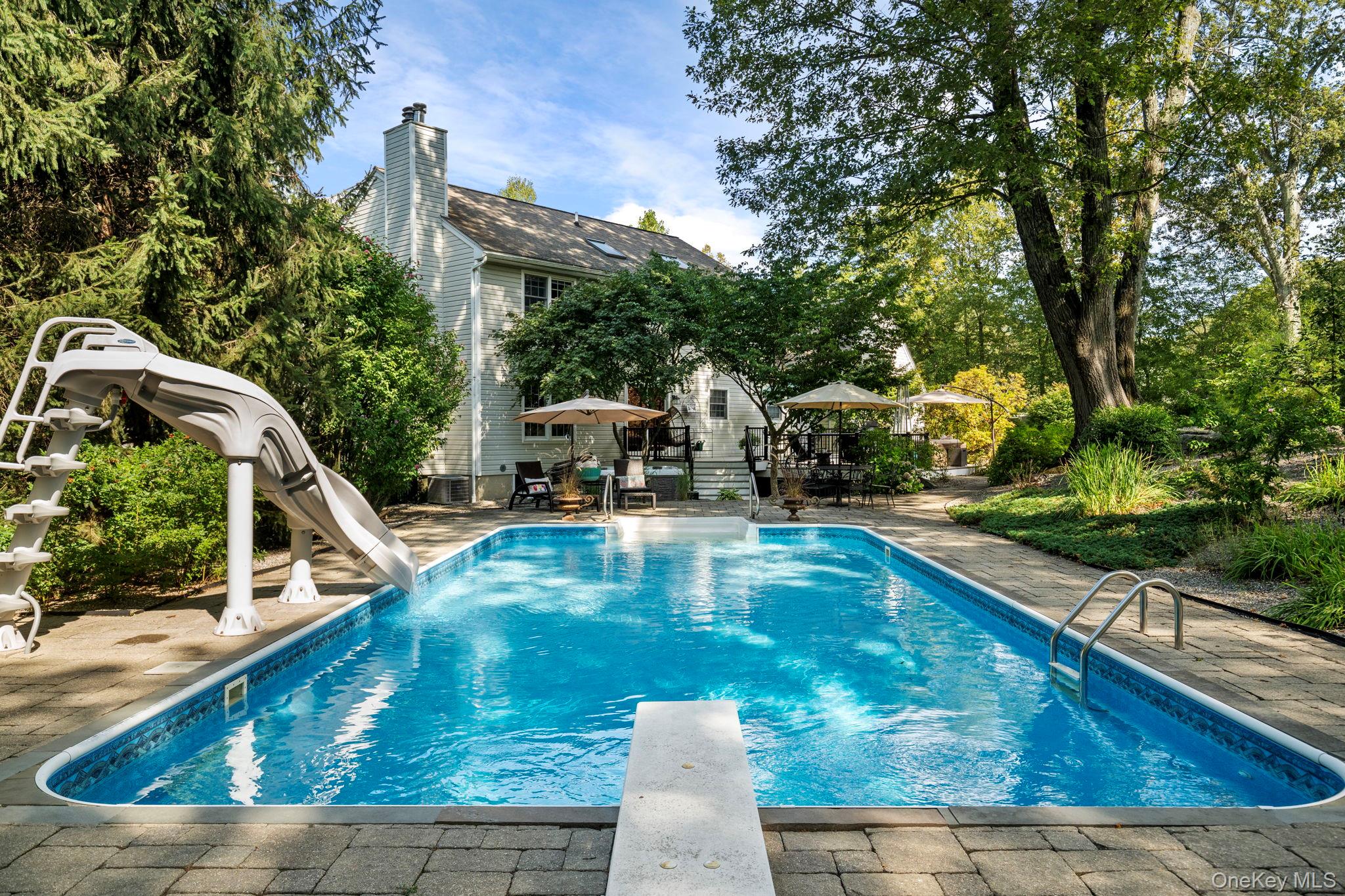 6 Ridge Circle Mahopac, NY 10541 - Photo 38 of 49 a view of a swimming pool with a patio