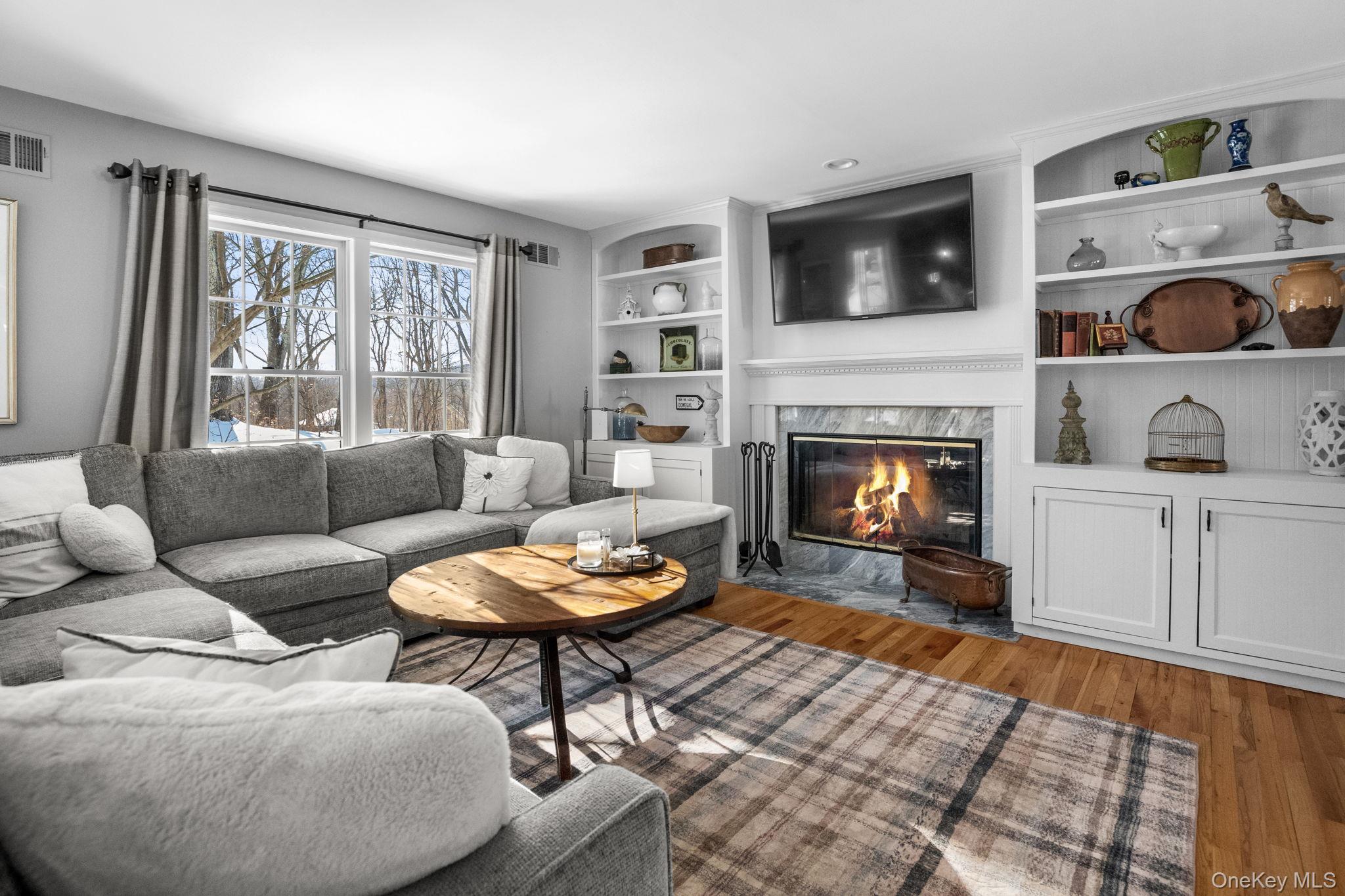 6 Ridge Circle Mahopac, NY 10541 - Photo 6 of 49 a living room with furniture fireplace and flat screen tv