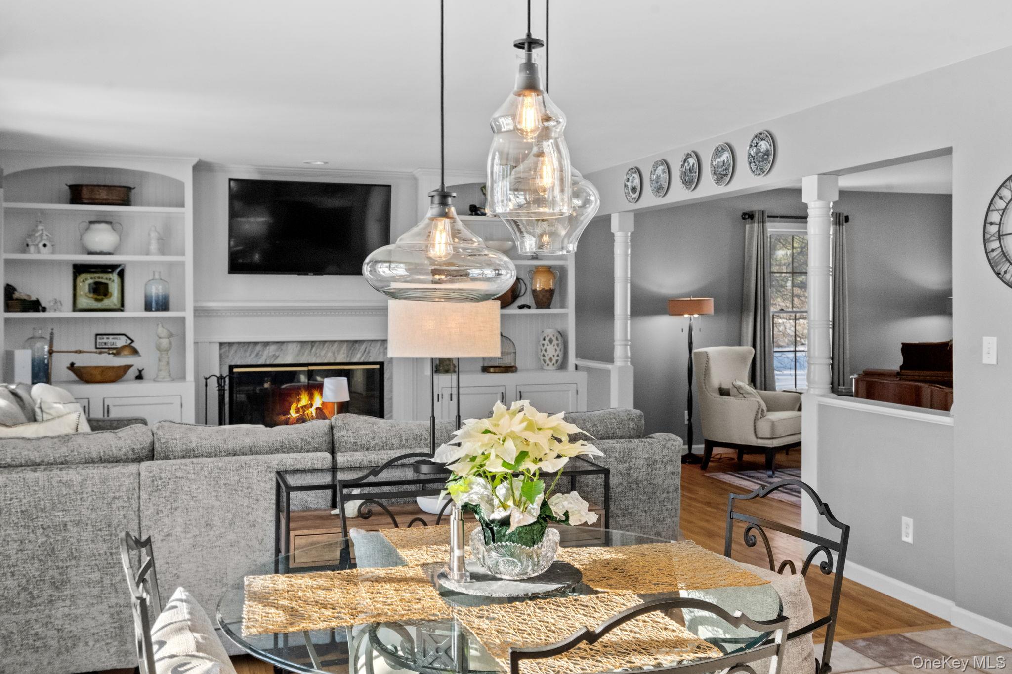 6 Ridge Circle Mahopac, NY 10541 - Photo 8 of 49 a living room with furniture a fireplace and a flat screen tv