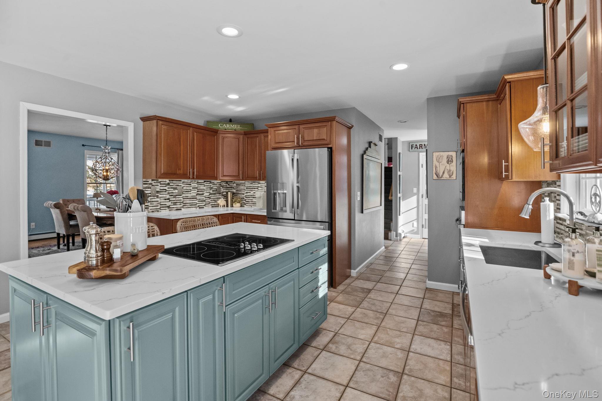 6 Ridge Circle Mahopac, NY 10541 - Photo 10 of 49 a kitchen with stainless steel appliances granite countertop a sink and a refrigerator