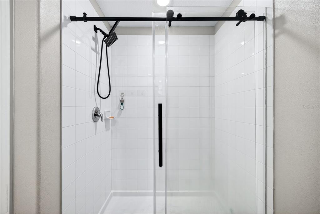 31724 Sun Kettle Loop Wesley Chapel, FL 33545 - Photo 22 of 49 a bathroom that has a shower in it