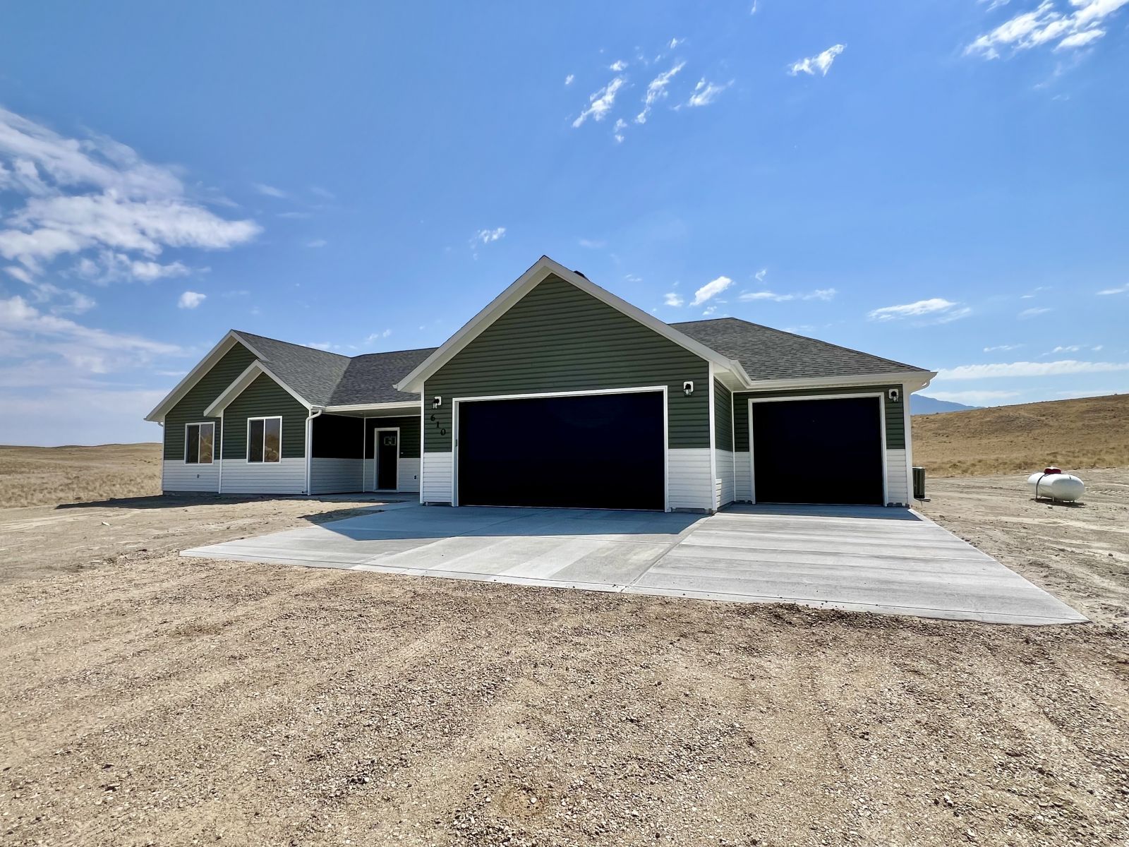 610 Ridgeway Drive Spring Creek, NV 89815 - Photo 31 of 33 a front view of a house with a yard and garage