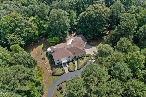 an aerial view of a house with outdoor space and street view