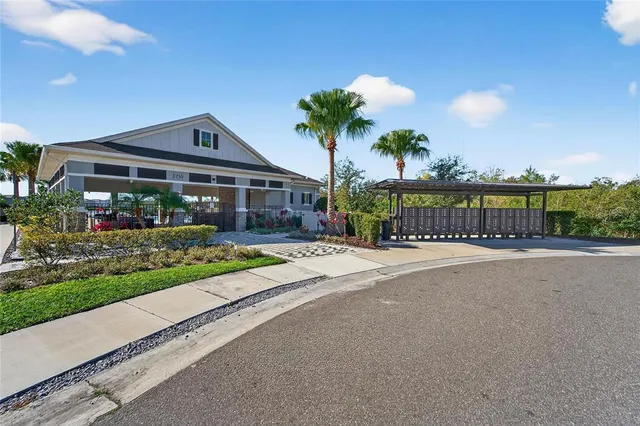 a front view of a house with a garden and a yard