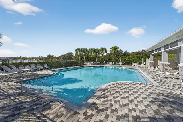 a view of a swimming pool with a lake view