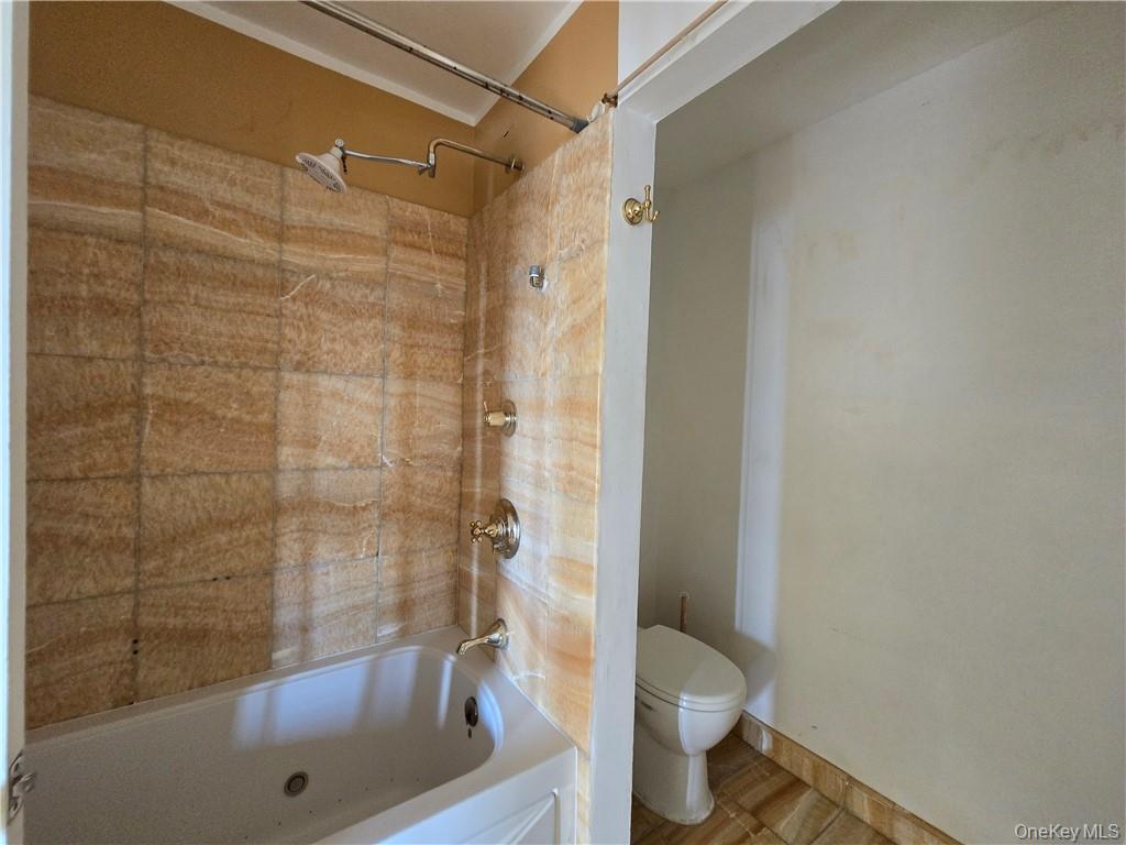44 Inwood Road Middletown, NY 10941 - Photo 11 of 15 Bathroom featuring tiled shower / bath combo and toilet