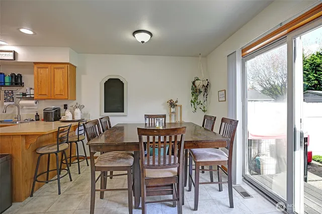 a view of a dining room with furniture window and outside view