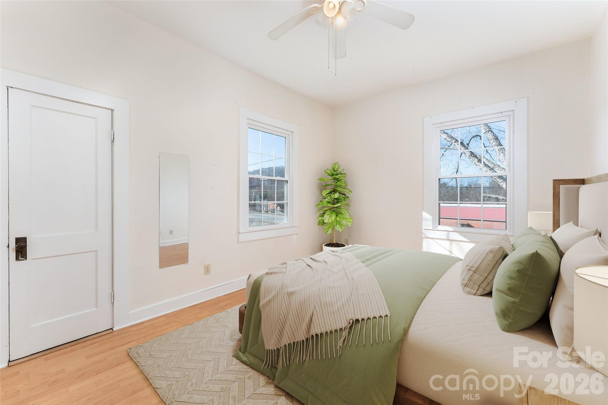20 1st Street Marion, NC 28752 - Photo 12 of 23 a bedroom with a bed and a window