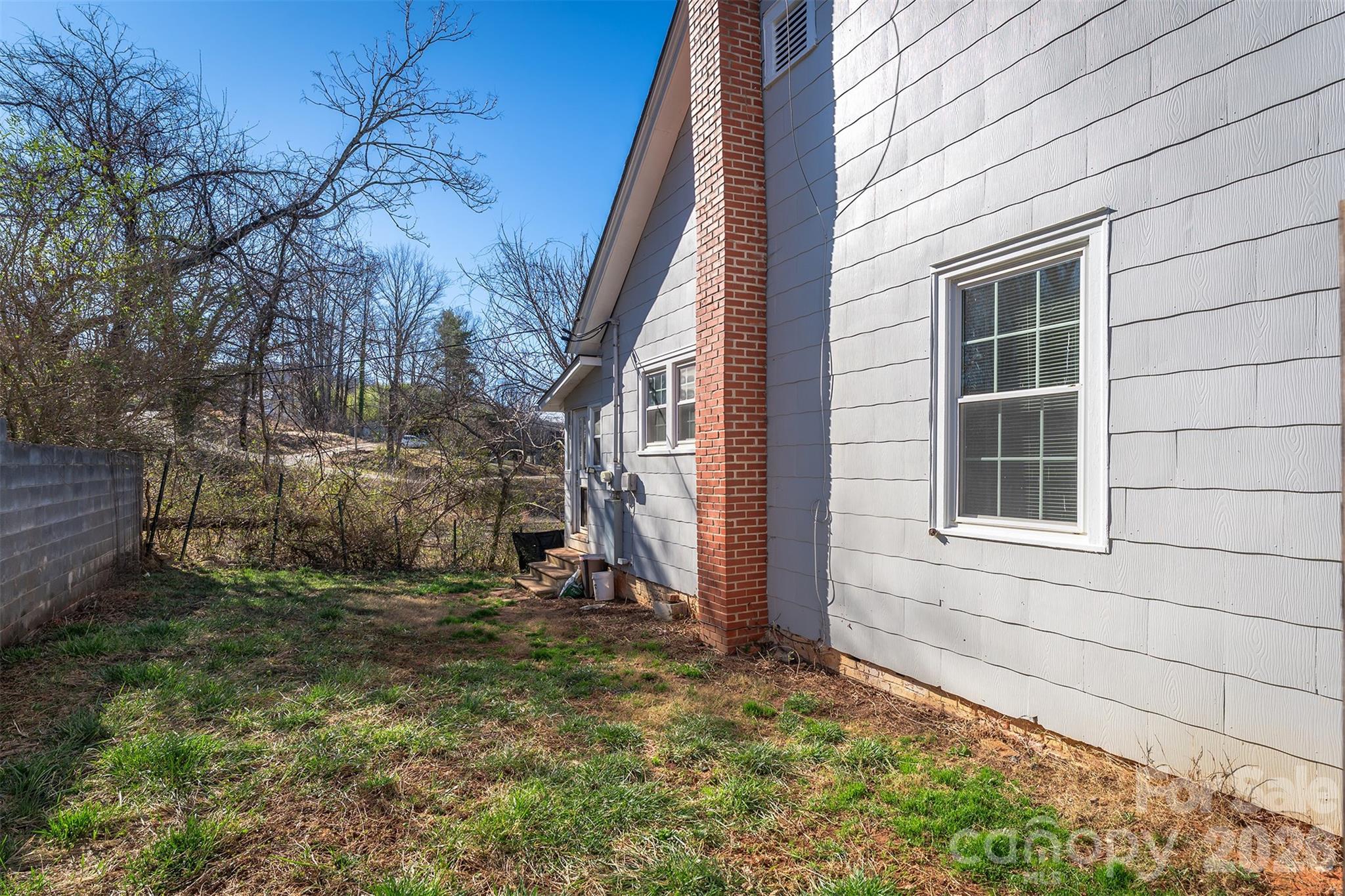20 1st Street Marion, NC 28752 - Photo 18 of 23 a view of house with backyard