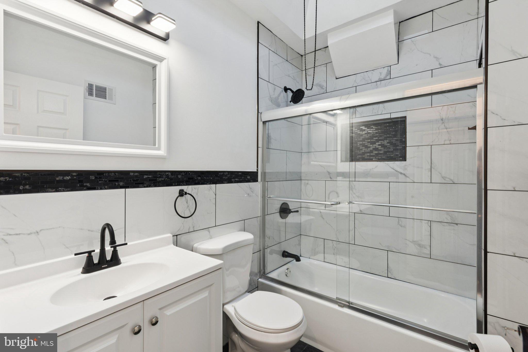 2242 South Bonsall Street Philadelphia, PA 19145 - Photo 15 of 21 a bathroom with a sink toilet and shower