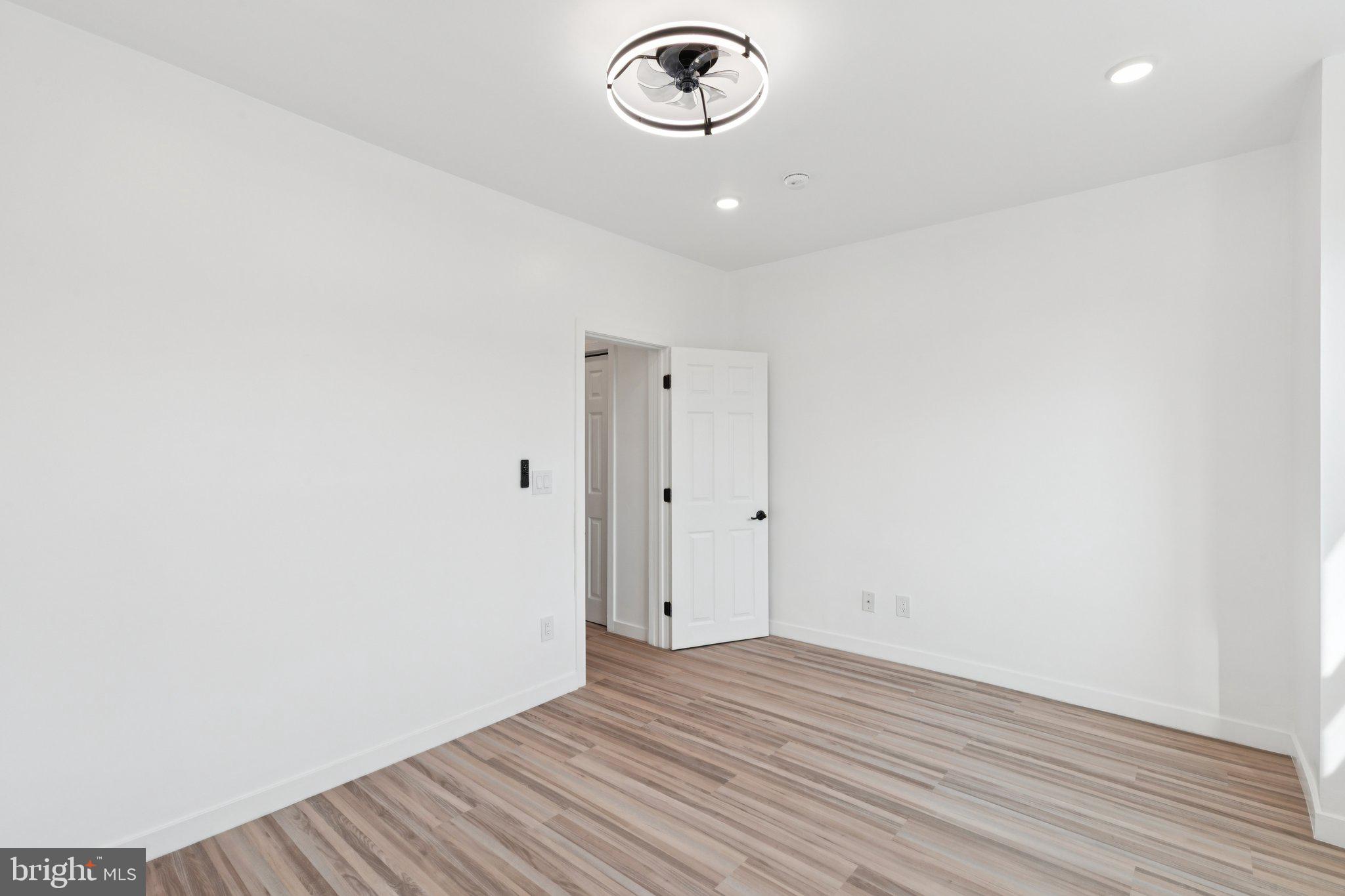 2242 South Bonsall Street Philadelphia, PA 19145 - Photo 17 of 21 a view of empty room with wooden floor