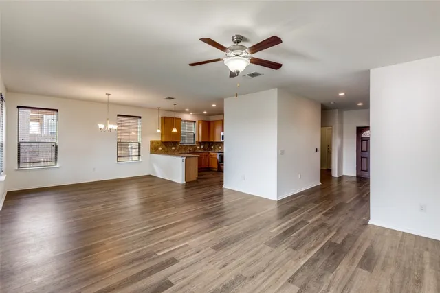 a view of a kitchen with a sink and a stove top oven