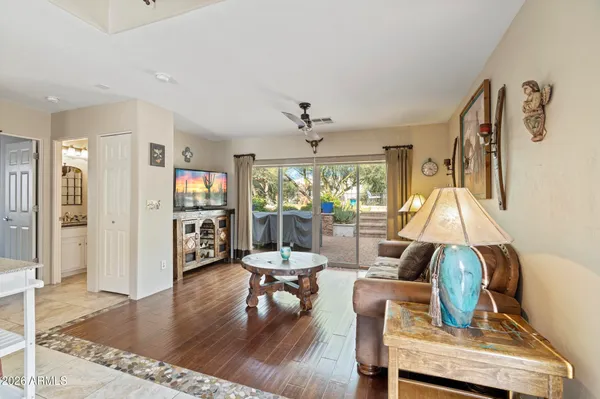 a living room with furniture and a large window