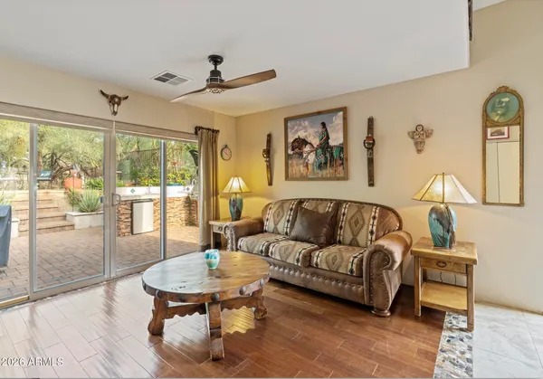 a living room with furniture and a large window