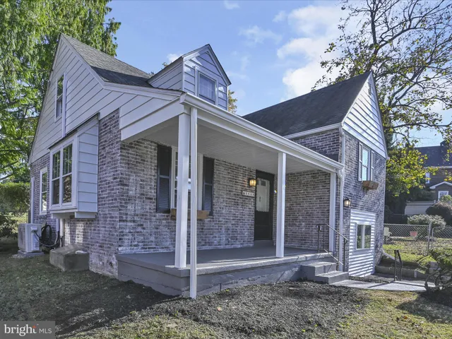 a view of a brick house with a large windows