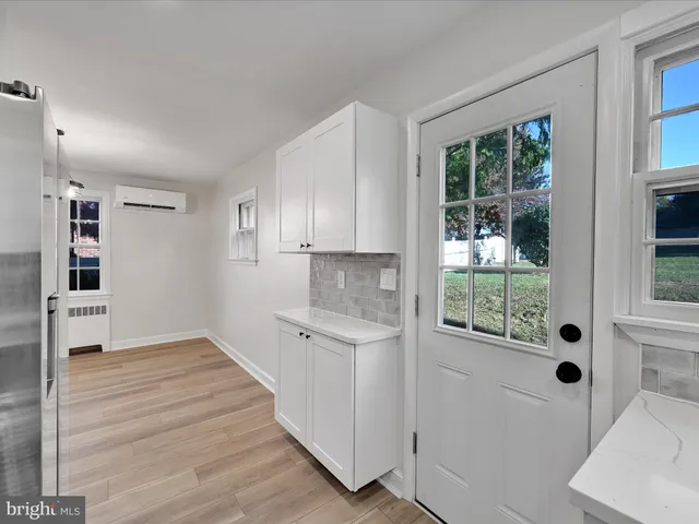 a view of a kitchen cabinets and wooden floor