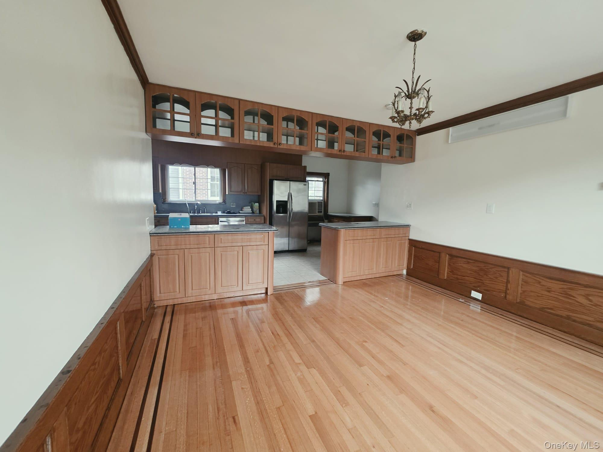 180-15 Dalny Road Queens, NY 11432 - Photo 4 of 10 a kitchen with stainless steel appliances granite countertop a stove and cabinets