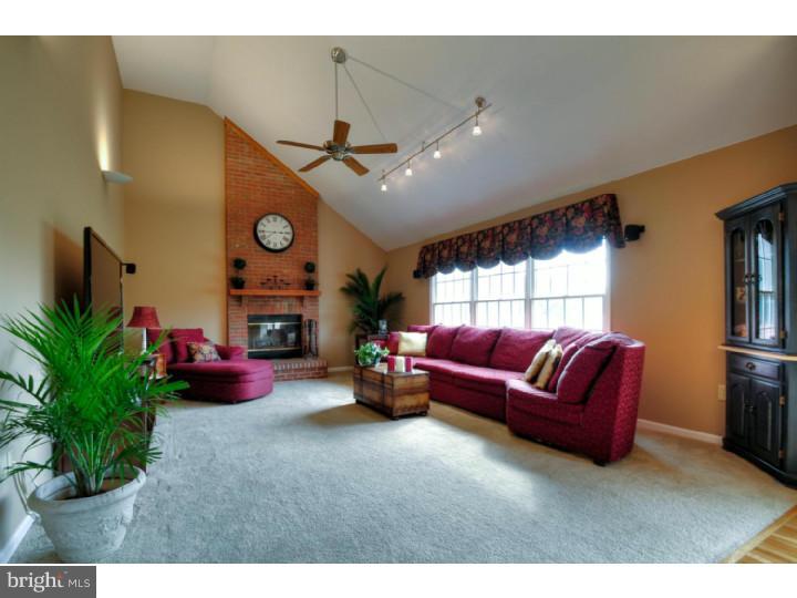 20 Zaitz Farm Road Princeton Junction, NJ 08550 - Photo 11 of 25 a living room with furniture and a flat screen tv