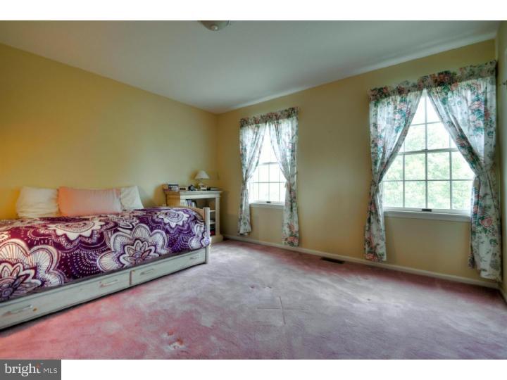 20 Zaitz Farm Road Princeton Junction, NJ 08550 - Photo 18 of 25 a spacious bedroom with a bed and a window