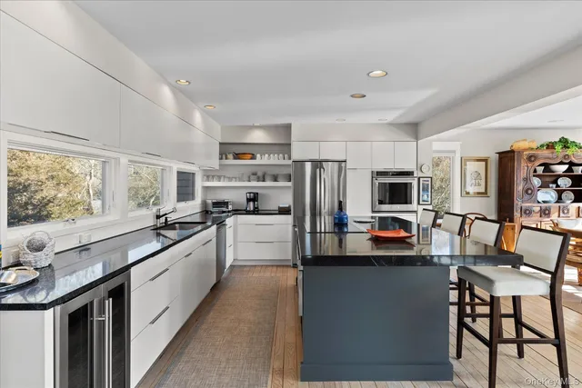 a kitchen with counter top space cabinets and stainless steel appliances