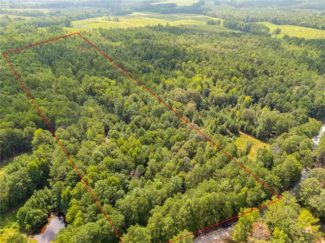 a view of a field with an outdoor space