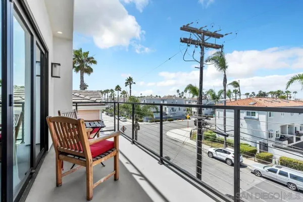 a view of a balcony with furniture