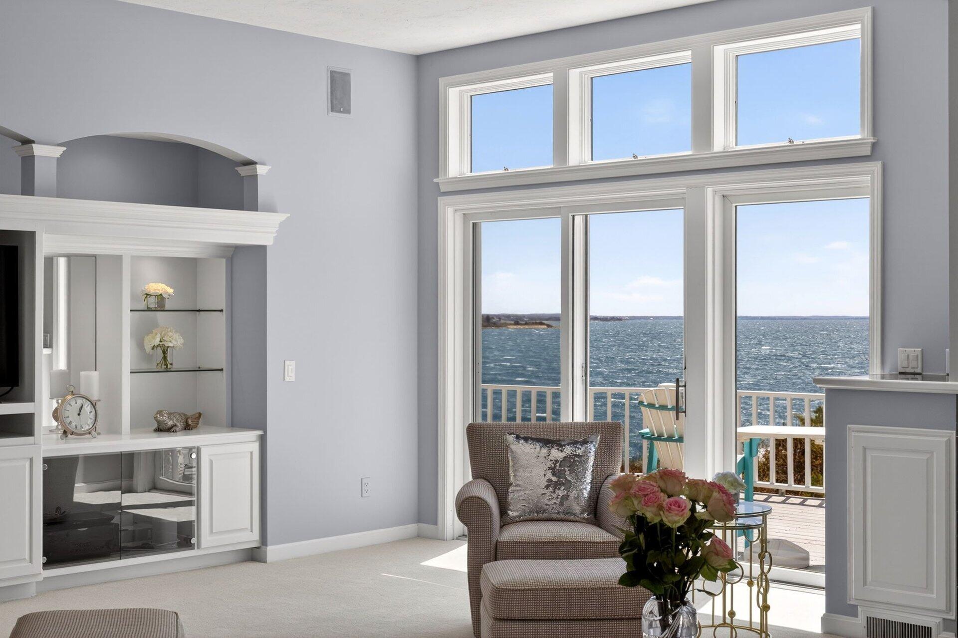 461 Wings Neck Road Pocasset, MA 02559 - Photo 12 of 42 a living room with furniture and a floor to ceiling window