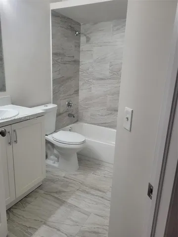 a view of a hallway with white walls